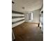 Bedroom with gray and white striped wall and brown carpet at 1779 Big Horn Se Ct, Conyers, GA 30013