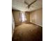 Bedroom with brown carpet and a window with light curtains at 1779 Big Horn Se Ct, Conyers, GA 30013