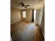 Spacious bedroom with ceiling fan and window at 1779 Big Horn Se Ct, Conyers, GA 30013