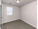 Bright bedroom with neutral walls, carpet, and window with blinds at 2089 Glenwood Downs Dr, Decatur, GA 30035