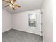 Bedroom with ceiling fan, window with blinds, and neutral decor at 2089 Glenwood Downs Dr, Decatur, GA 30035