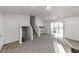 Living room with grey carpet, fireplace and stairs at 2089 Glenwood Downs Dr, Decatur, GA 30035