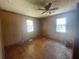 Hardwood floor bedroom with two windows at 214 Pinewood Ln, Stockbridge, GA 30281