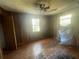 Empty bedroom with hardwood floors and window at 214 Pinewood Ln, Stockbridge, GA 30281