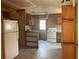 A fixer-upper kitchen with wood cabinets and white appliances at 214 Pinewood Ln, Stockbridge, GA 30281