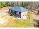 Ranch house nestled in a wooded area with a yard at 2580 County Line Sw Rd, Atlanta, GA 30331