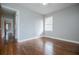 Spacious bedroom with hardwood floors, ceiling fan and neutral walls at 2580 County Line Sw Rd, Atlanta, GA 30331