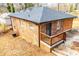 Rear view of brick house with wooden deck and landscaping at 2580 County Line Sw Rd, Atlanta, GA 30331