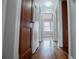 Long hallway with hardwood floors and neutral walls at 2580 County Line Sw Rd, Atlanta, GA 30331