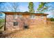 Brick house exterior with landscaping and partial deck at 2580 County Line Sw Rd, Atlanta, GA 30331