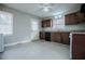 Eat-in kitchen with granite countertops, dark wood cabinets, and white appliances at 2580 County Line Sw Rd, Atlanta, GA 30331