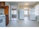 Kitchen with dark cabinets and white appliances at 2580 County Line Sw Rd, Atlanta, GA 30331