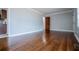 Living room with hardwood floors and view into kitchen at 2580 County Line Sw Rd, Atlanta, GA 30331