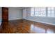 Spacious living room featuring hardwood floors and large windows at 2580 County Line Sw Rd, Atlanta, GA 30331