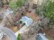 A high angle shot of the home situated on a private lot with a long driveway at 6389 Grafton Dr, Austell, GA 30168