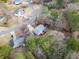 Aerial view of a home with a deck surrounded by lush greenery in a serene neighborhood at 6389 Grafton Dr, Austell, GA 30168