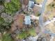 Birds eye view of home showcasing a backyard deck surrounded by mature trees at 6389 Grafton Dr, Austell, GA 30168