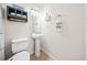 A bathroom featuring a toilet, sink, and cabinet at 6389 Grafton Dr, Austell, GA 30168