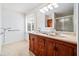 Bathroom with double sink vanity, lots of counter space, and enclosed shower at 6389 Grafton Dr, Austell, GA 30168