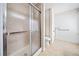 A bathroom featuring a walk-in shower, toilet, and grab bars at 6389 Grafton Dr, Austell, GA 30168