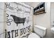 Bathroom featuring a toilet, sink, and decorative shower curtain at 6389 Grafton Dr, Austell, GA 30168