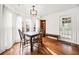 Bright dining area features hardwood floors, windows, and an elegant chandelier at 6389 Grafton Dr, Austell, GA 30168