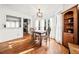 Dining room with hardwood floors, a wooden table, and natural light from the window at 6389 Grafton Dr, Austell, GA 30168