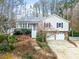 Charming home with a well-maintained front yard and attached two-car garage at 6389 Grafton Dr, Austell, GA 30168