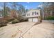 Charming home featuring a two-car garage and a basketball hoop above the driveway at 6389 Grafton Dr, Austell, GA 30168