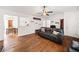 Inviting living room with hardwood floors, a comfortable couch, and a decorative bookshelf at 6389 Grafton Dr, Austell, GA 30168