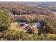 Aerial view of the property showing the house and surrounding woods at 686 Newton Factory Bridge Rd, Covington, GA 30014