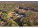 Aerial view showing home, expansive lot, and wooded surroundings at 686 Newton Factory Bridge Rd, Covington, GA 30014