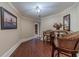 Finished basement with hardwood floors and seating area at 686 Newton Factory Bridge Rd, Covington, GA 30014