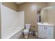 Clean bathroom with a toilet, bathtub, and vanity at 686 Newton Factory Bridge Rd, Covington, GA 30014