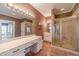 Elegant bathroom with double vanity, large shower, and separate tub at 686 Newton Factory Bridge Rd, Covington, GA 30014