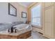 Relaxing bathroom features a jetted tub and large window at 686 Newton Factory Bridge Rd, Covington, GA 30014