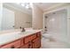 Clean bathroom with single vanity, shower/tub combo, and tile floor at 686 Newton Factory Bridge Rd, Covington, GA 30014