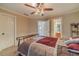 Charming bedroom with a ceiling fan and access to a bathroom at 686 Newton Factory Bridge Rd, Covington, GA 30014