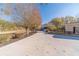 Long driveway leading to a beautiful home with autumn trees at 686 Newton Factory Bridge Rd, Covington, GA 30014