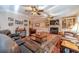 Spacious Gathering room featuring a fireplace, built-in shelving, and hardwood floors at 686 Newton Factory Bridge Rd, Covington, GA 30014