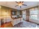 Bright home office with built-in shelving and hardwood floors at 686 Newton Factory Bridge Rd, Covington, GA 30014