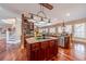 Kitchen island with granite countertop and stainless steel appliances at 686 Newton Factory Bridge Rd, Covington, GA 30014