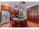 Stainless steel appliances and custom wood cabinetry highlight this kitchen at 686 Newton Factory Bridge Rd, Covington, GA 30014