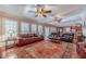 Open living room with hardwood floors, a fireplace, and a view to the kitchen at 686 Newton Factory Bridge Rd, Covington, GA 30014