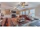 Relaxing living room with hardwood floors, a fireplace, and large windows at 686 Newton Factory Bridge Rd, Covington, GA 30014