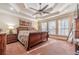 Main bedroom with tray ceiling, hardwood floors, and large windows at 686 Newton Factory Bridge Rd, Covington, GA 30014