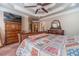 Main bedroom with a large bed, wooden dresser and carpet flooring at 686 Newton Factory Bridge Rd, Covington, GA 30014