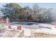 Relaxing pool area with safety cover and comfortable seating at 686 Newton Factory Bridge Rd, Covington, GA 30014