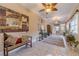 Bright sunroom with tile floors, ceiling fans, and ample natural light at 686 Newton Factory Bridge Rd, Covington, GA 30014