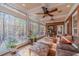 Sunroom with hardwood floors, ceiling fan, and ample natural light at 686 Newton Factory Bridge Rd, Covington, GA 30014